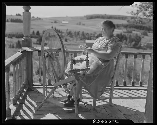 Fort Kent, Maine (vicinity). Wife of Albert [i.e. Leonard] Gagnon, Acadian FSA (Farm Security Administration) client, spinning domestic wool for knitting