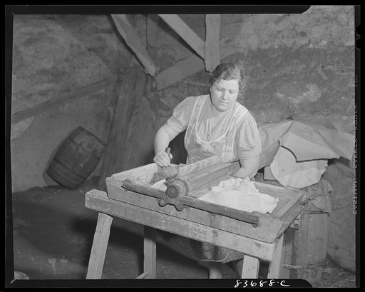 Fort Kent, Maine. (vicinity). Mrs. [Leonard] Gagnon making butter