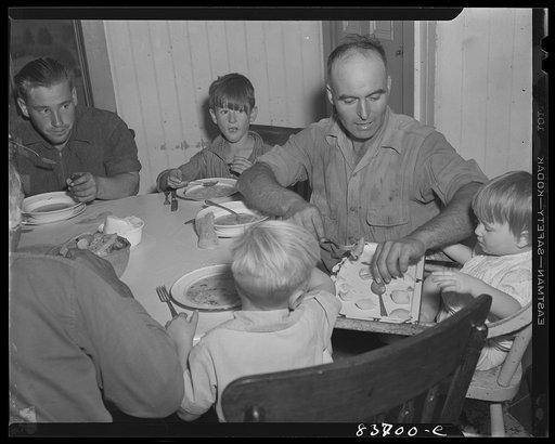Fort Kent, Maine (vicinity). Leonard Gagnon sitting at the head of the family table
