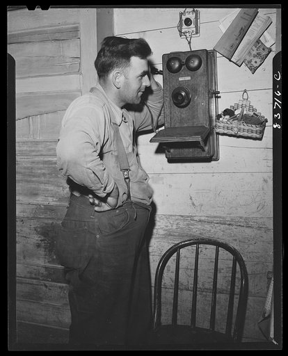 Fort Kent, Maine (vicinity). Edward [i.e. Oneil] Daigle has a telephone so that he will not worry about his family when he is in the woods cutting wood in the winter