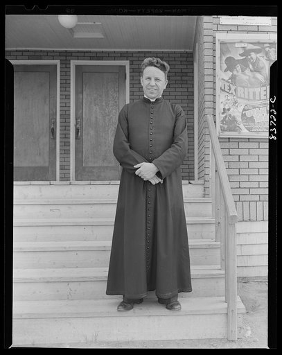 Aroostook County, Maine. Father Soucy on the steps of the community theater which he organized