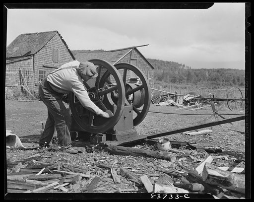 Untitled photo, possibly related to: Fort Kent, Maine (vicinity). Cutting wood