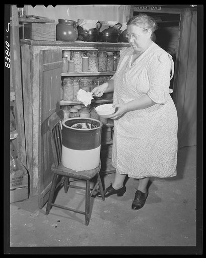 Hartford, Connecticut (vicinity). Polish farmer's wife with lard made from a home-fed pig