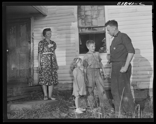 Norwich, Connecticut (vicinity). Swedish farmer who also works in defense plant to pay off debt on farm. He has just arrived home from the factory and in a few minutes will be doing odd chores around the farm