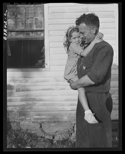 Norwich, Connecticut (vicinity). Swedish farmer who also works in defense plant to pay off debt on farm. He has just arrived home from the factory, and in a few minutes will be doing odd chores around the farm