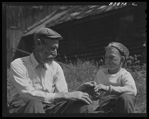 Untitled photo, possibly related to: Windsor Locks, Connecticut (vicinity). Jewish rabbi and farmer talking things over with German boy who lives down the road