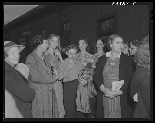 Richwood, West Virginia. Women and girls waiting to board train for Batavia, New York where they will work in the harvest