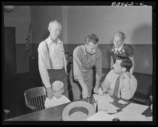Richwood, West Virginia. The Friend family contracting with the FSA (Farm Security Administration) representative to go to upper New York state to work during the farm labor storage