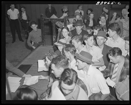Richwood, West Virginia. Migratory workers having contracts checked before boarding train