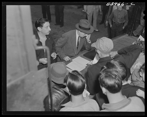 Richwood, West Virginia. Migratory workers having contracts checked before boarding train