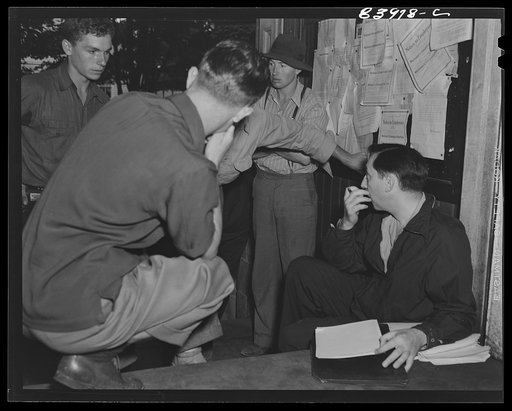 Untitled photo, possibly related to: Summersville, West Virginia. FSA (Farm Security Administration) representative recruiting labor on the courthouse steps