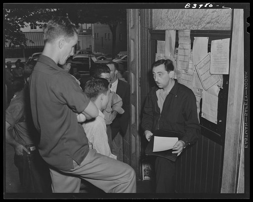 Summersville, West Virginia. FSA (Farm Security Administration) representative recruiting labor on the courthouse steps