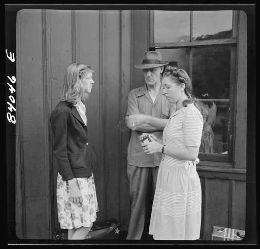 Richwood, West Virginia. Girls waiting to leave for upper New York state to help with the harvest