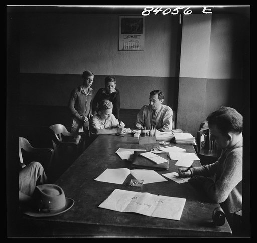 Richwood, West Virginia. FSA (Farm Security Administration) representative signing up high school boys to go by special train to upper New York state to help bring in the harvest