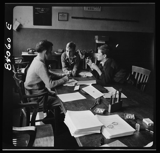 Untitled photo, possibly related to: Richwood, West Virginia. FSA (Farm Security Administration) representative signing up high school boys to go by special train to upper New York state to help bring in the harvest