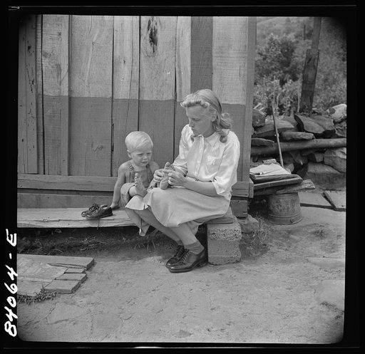 Richwood, West Virginia. (vicinity) Hazel Friend and her son, Darriell, in front of their home