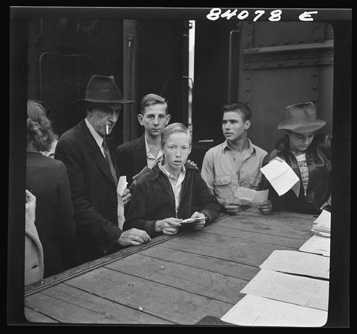 Untitled photo, possibly related to: Richwood, West Virginia. Men and boys boarding train for Batavia, New York, where they will help in the harvest