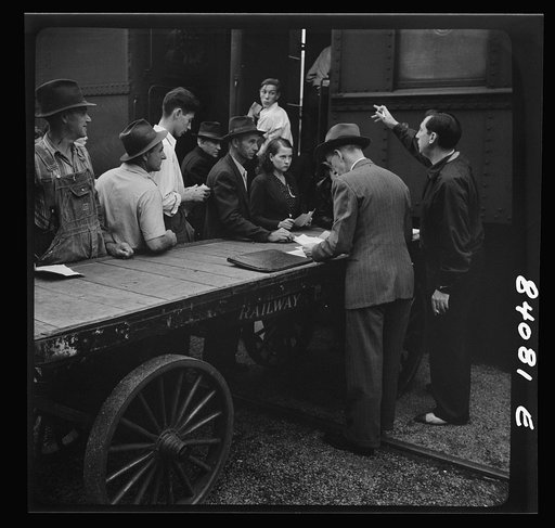 Richwood, West Virginia. Men and boys boarding train for Batavia, New York, where they will help in the harvest