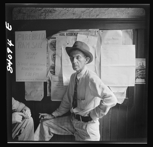 Summersville, West Virginia. Cynical citizens watching FSA (Farm Security Administration) official recruiting laborers to bring in the crops in New York state