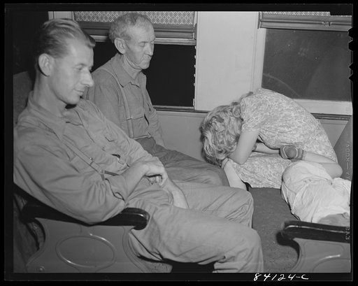 The Friends sleeping as best they can. En route from Richwood, West Virginia to Batavia, New York to work in the harvest
