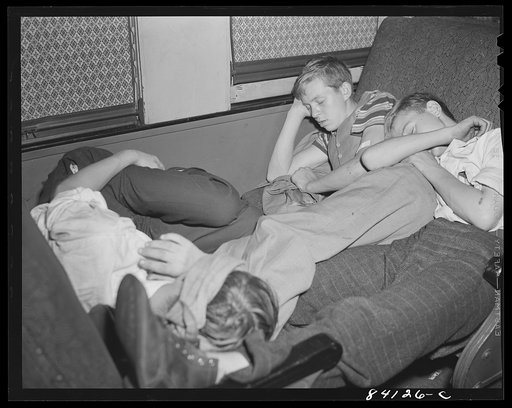 Boys sleeping as best they can on special train from Richwood, West Virginia to upper New York state to work in the harvest