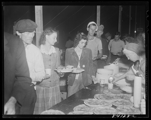 Batavia, New York. Elba FSA (Farm Security Administration) farm labor camp. Bryant Friend and his father getting their first meal since leaving Richwood, West Virginia.