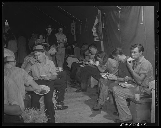 Batavia, New York. Elba FSA (Farm Security Administration) farm labor camp. The Red Cross serving migrants from West Virginia their first hot meal since leaving home