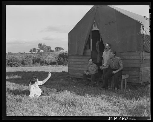 Untitled photo, possibly related to: Batavia, New York. Elba FSA (Farm Security Administration) farm labor camp. Men who had been on relief in New York City talking the situation over after a day's work in the muck fields