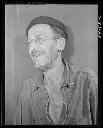 Untitled photo, possibly related to: Batavia, New York. Elba FSA (Farm Security Administration) farm labor camp. George Wright, fifty, ex-showman and jack of all trades whose last job was in a sugar refinery where he broke a leg. He had been on relief since 1929, until the relief agency in New York 