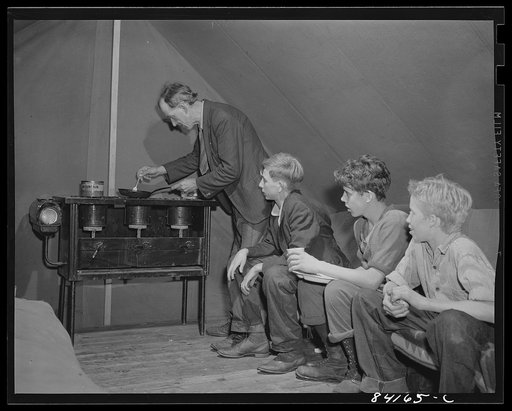 Batavia, New York. Elba FSA (Farm Security Administration) farm labor camp. William Sloan is looking after these boys while they work in the harvest. He is doing the cooking and keeping them out of trouble. They will return to school later in the fall