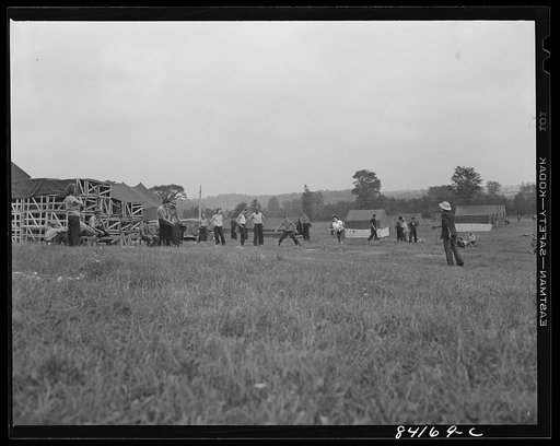 Batavia, New York. Elba FSA (Farm Security Administration) farm labor camp. Despite rain and empty stomachs, the boys and girls just off the train from West Virginia started a ball game