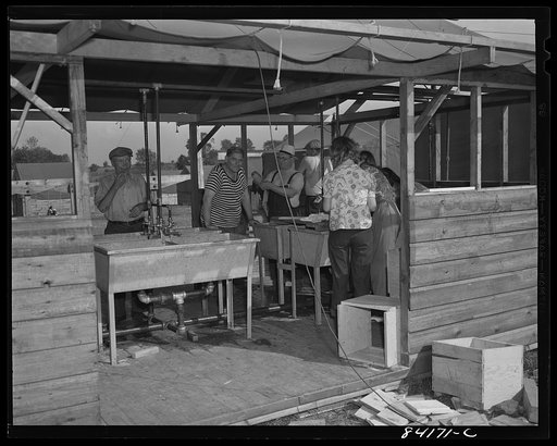 Batavia, New York. Elba FSA (Farm Security Administration) farm labor camp. Migrants from both New York City and West Virginia washing up after work