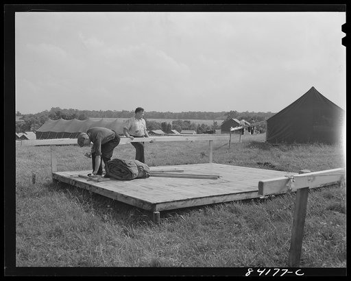 Batavia, New York. Elba FSA (Farm Security Administration) farm labor camp. Tent being put up to house the migrants