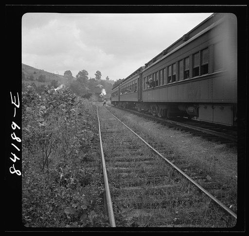 Untitled photo, possibly related to: Picking up the Clay section of the special train carrying agricultural workers to upper New York state