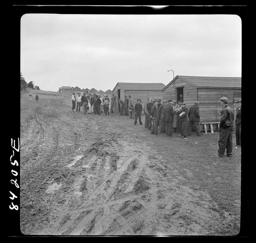 Untitled photo, possibly related to: Batavia, New York. Elba FSA (Farm Security Administration) farm labor camp. Migrant waiting for work in front of the United States employment service office