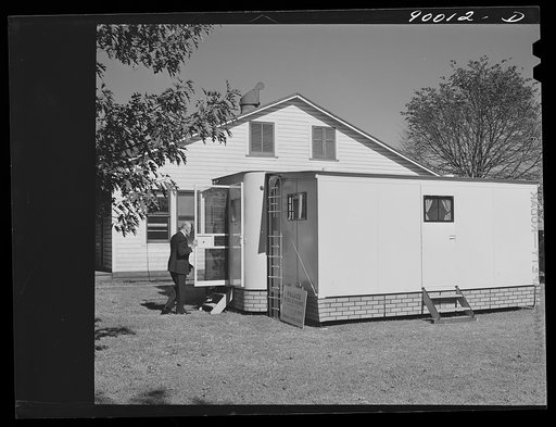 Untitled photo, possibly related to: Palace mobile home. Expansion trailer for emergency defense housing demonstrated in Washington tourist camp. Washington, D.C.