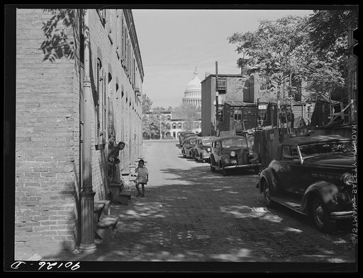 Untitled photo, possibly related to: Temple Court off D Street and Delaware Avenue, S.W. Washington, D.C. Negro slum area with Capitol in background