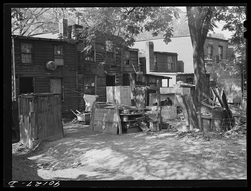 Untitled photo, possibly related to: Negro slum area between D and C Streets off 1st Street, S.W. Washington, D.C. Most houses have five small rooms renting for twenty dollars and fifty cents a month, with rear wood kitchen shed, cold water, outdoor privy