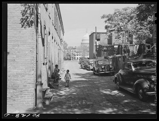 Untitled photo, possibly related to: Temple Court off D Street and Delaware Avenue, S.W. Washington, D.C. Negro slum area with Capitol in background