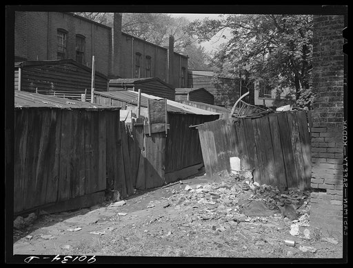 Untitled photo, possibly related to: Negro slum area between D and C Streets off 1st Street, S.W. Washington, D.C. Most houses have five small rooms renting for twenty dollars and fifty cents a month, with rear wood kitchen shed, cold water, outdoor privy