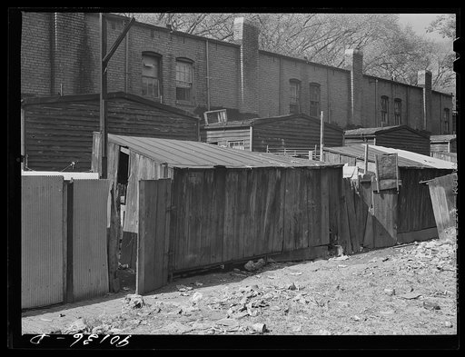 Negro slum area between D and C Streets off 1st Street, S.W. Washington, D.C. Most houses have five small rooms renting for twenty dollars and fifty cents a month, with rear wood kitchen shed, cold water, outdoor privy