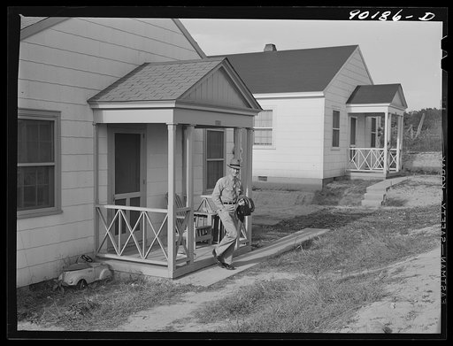 Fred B. Williams from Savannah, Georgia, a safety engineer at the powder plant, leaving his home at 803 9th Steet. Sunset Village, Radford, Virginia. FSA (Farm Security Administration) project for defense workers