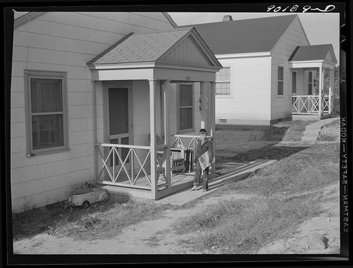 Untitled photo, possibly related to: Boy delivering newspapers to defense workers homes in Sunset Village. FSA (Farm Security Administration) project. Radford, Virginia