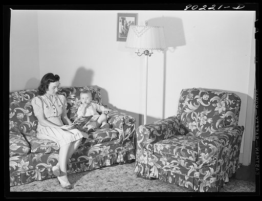 Mrs. Therman N. Ratcliff, defense worker's wife with their daughter, Mary K. Ratcliff, in their living room. Sunset Village, FSA (Farm Security Administration) project, Radford, Virginia