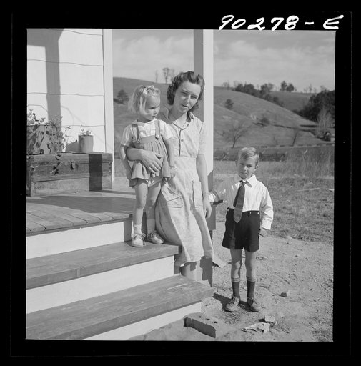 Riner, Virginia. Radford, Virginia (vicinity). Elsie Marie and Howard Jr., children of Mr. Howard H. Smith, with their mother on the porch of their new rural home, which was built for them by the FSA (Farm Security Administration) on J.T Holley's property