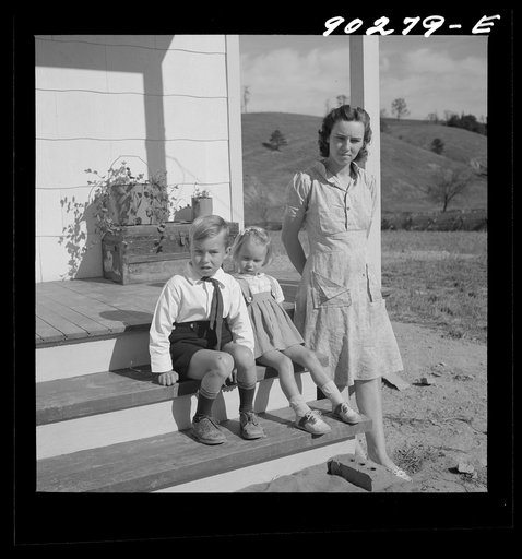 Untitled photo, possibly related to: Riner, Virginia. Radford, Virginia (vicinity). Elsie Marie and Howard Jr., children of Mr. Howard H. Smith, with their mother on the porch of their new rural home, which was built for them by the FSA (Farm Security Administration) on J.T Holley's property