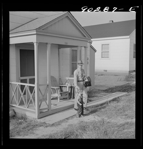 Fred B. Williams from Savannah, Georgia, a safety engineer at the powder plant, leaving his home at 803 9th Street. Sunset Village, Radford, Virginia. FSA (Farm Security Administration) project for defense workers