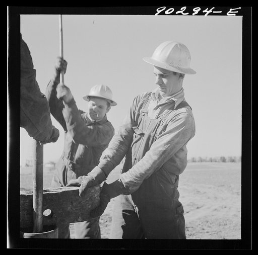 Untitled photo, possibly related to: Oil man by new well being drilled in Goodrich field of Continental oil company. Valley Center oil field near Wichita, Kansas