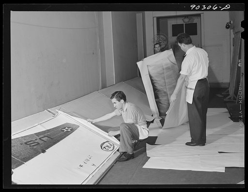 Untitled photo, possibly related to: Washington, D.C. Preparing the defense bond sales photomural to be installed in the Grand Central terminal, New York, in the photographic laboratory of the FSA (Farm Security Administration). Drying print strips in the corridor