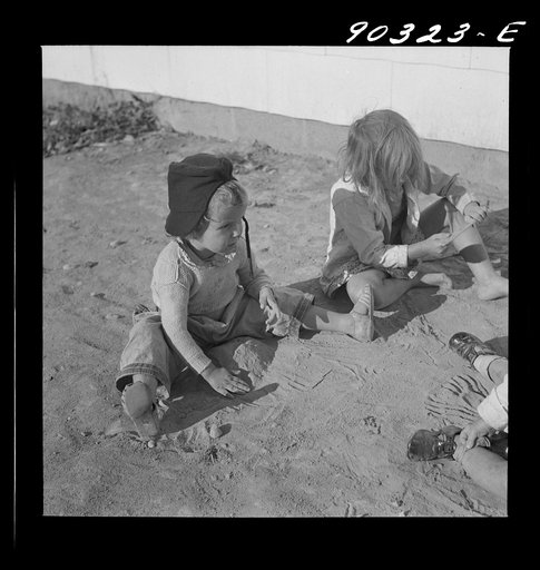 Children of defense workers playing outside their home in Sunset Village. FSA (Farm Security Administration) housing project. Radford, Virginia